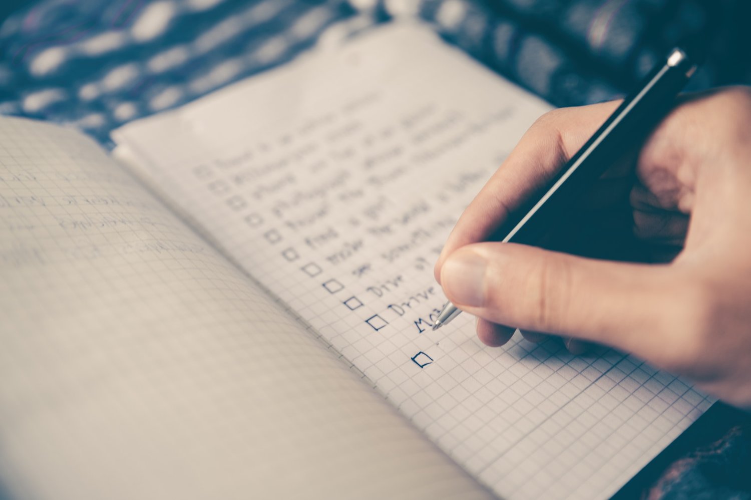 Neatly written bucket list with dreams, goals, and adventures — representing the inspiring process of mapping out meaningful life experiences.