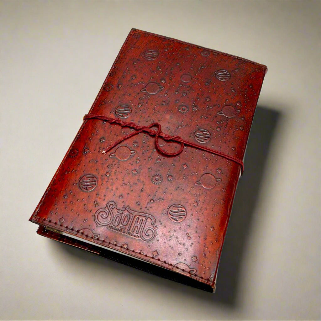 Space-themed leather notebook – embossed with galactic elements and adorned with a blue cobalt stone