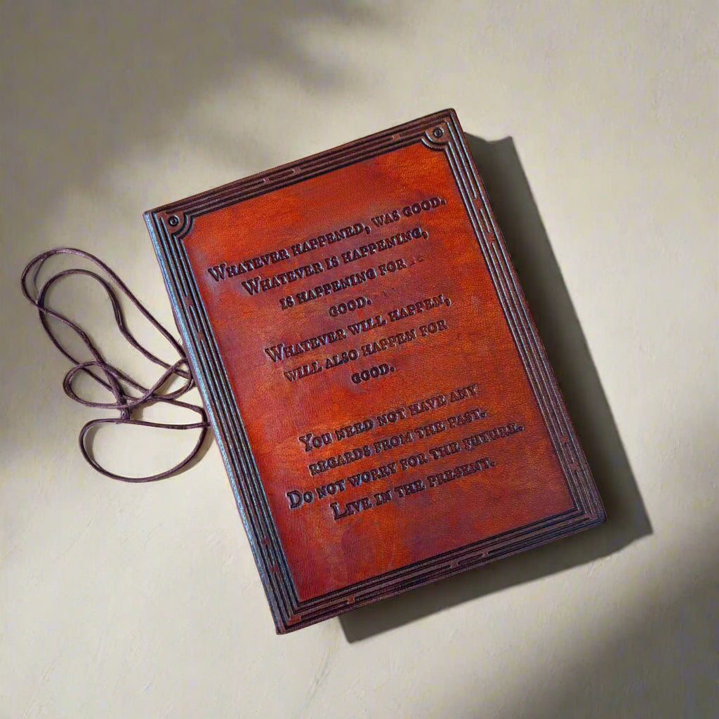 Brown leather-bound book with text on a beige background