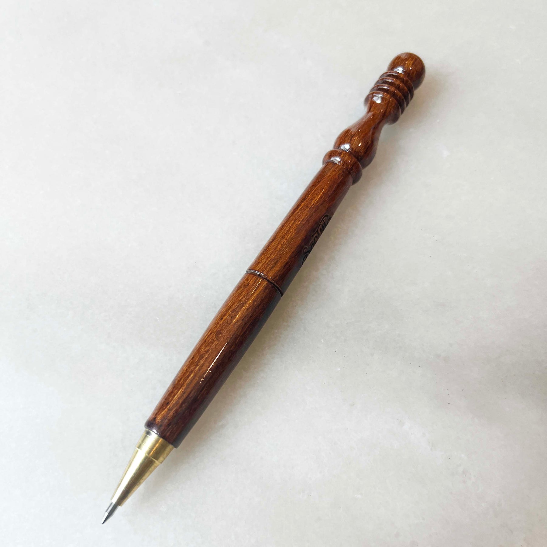 Elegant wood-carved pen with ‘Soothi’ logo engraving – artisanal and sustainable