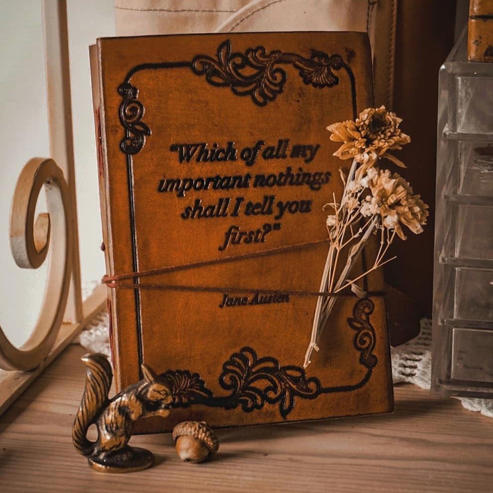 Earth-toned leather journal featuring embossed life quote – thoughtful companion for journaling and sketching on the go