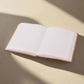 Open book with blank pages on a white background