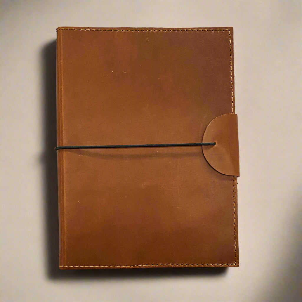 A5 Refillable Leather Journal in genuine buff leather, closed front view.