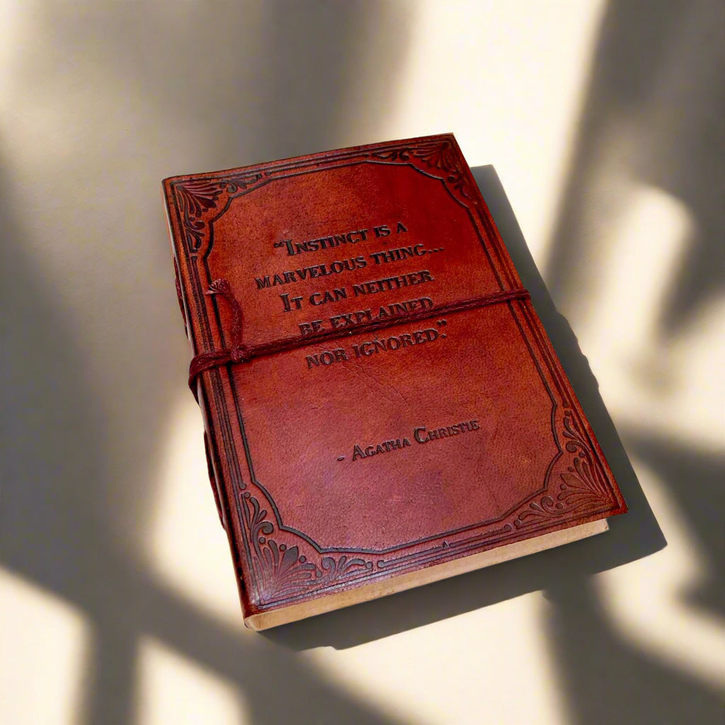 Another angle of the Agatha Christie Instinct Is a Marvelous Thing Leather Journal showing the cover and binding