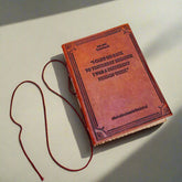 Earth-toned leather journal featuring embossed life quote – thoughtful companion for journaling and sketching on the go