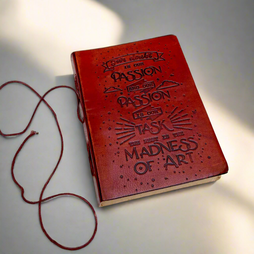 Another angle of the Henry James Our Doubt Is Our Passion Leather Journal showing the cover and binding