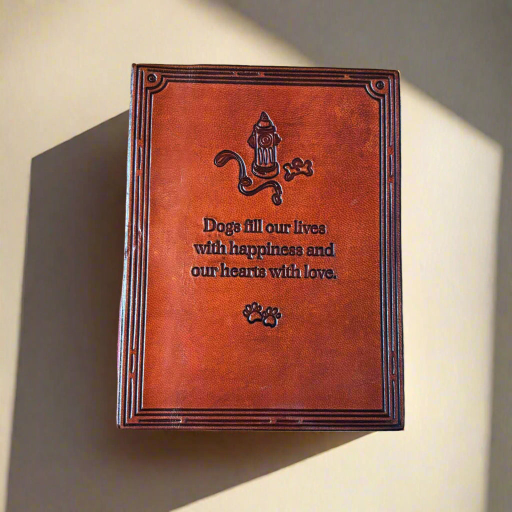 Brown leather-bound book with dog-themed design and text on a beige background