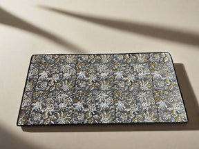 Matching desk mat, pen holder, and storage box in a sophisticated grey and white artisan print.