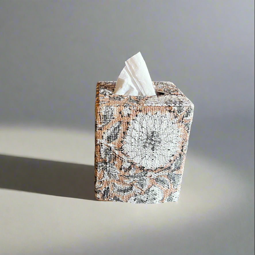 Tissue box with tissues on a gray background