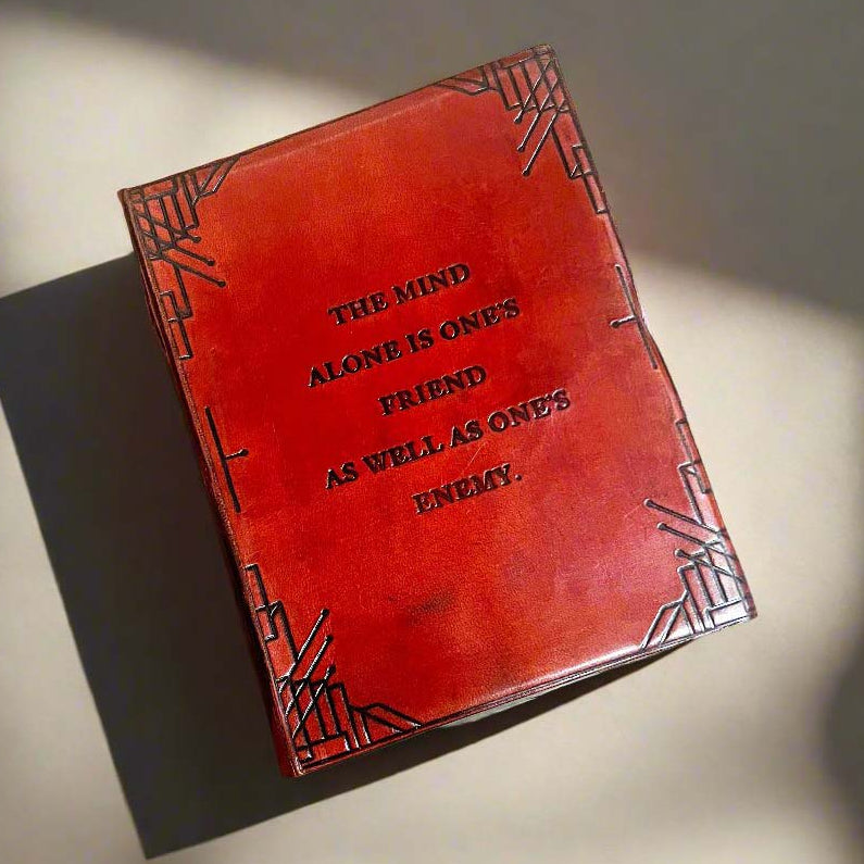The Mind Alone brown leather journal with a debossed quote and string-tie closure