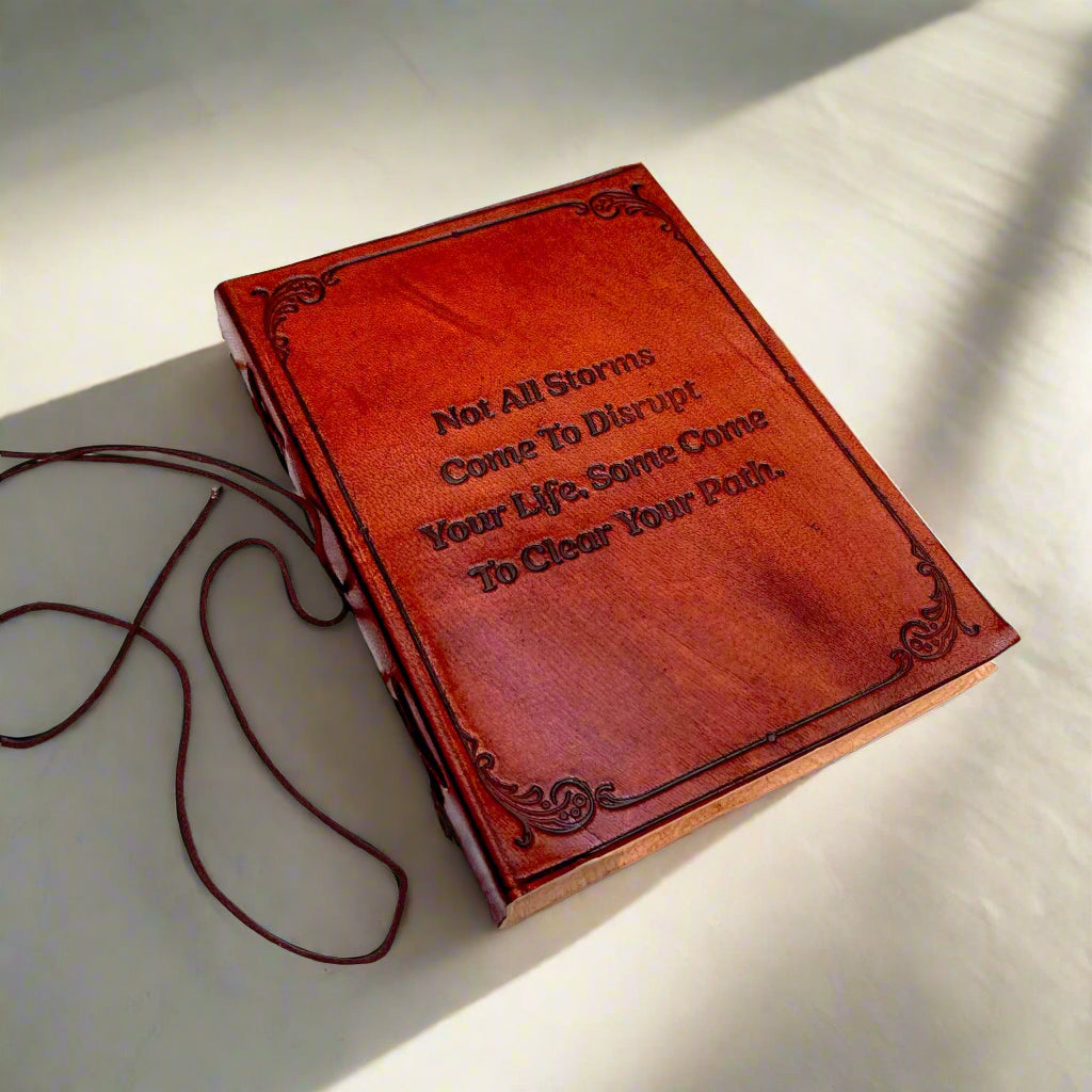 Soothi Not All Storms embossed leather journal with string tie