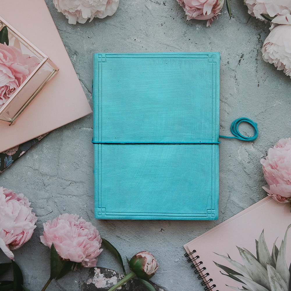 Light Blue Plain Cover Leather Journal with lined pages, 6 x 8 inches.