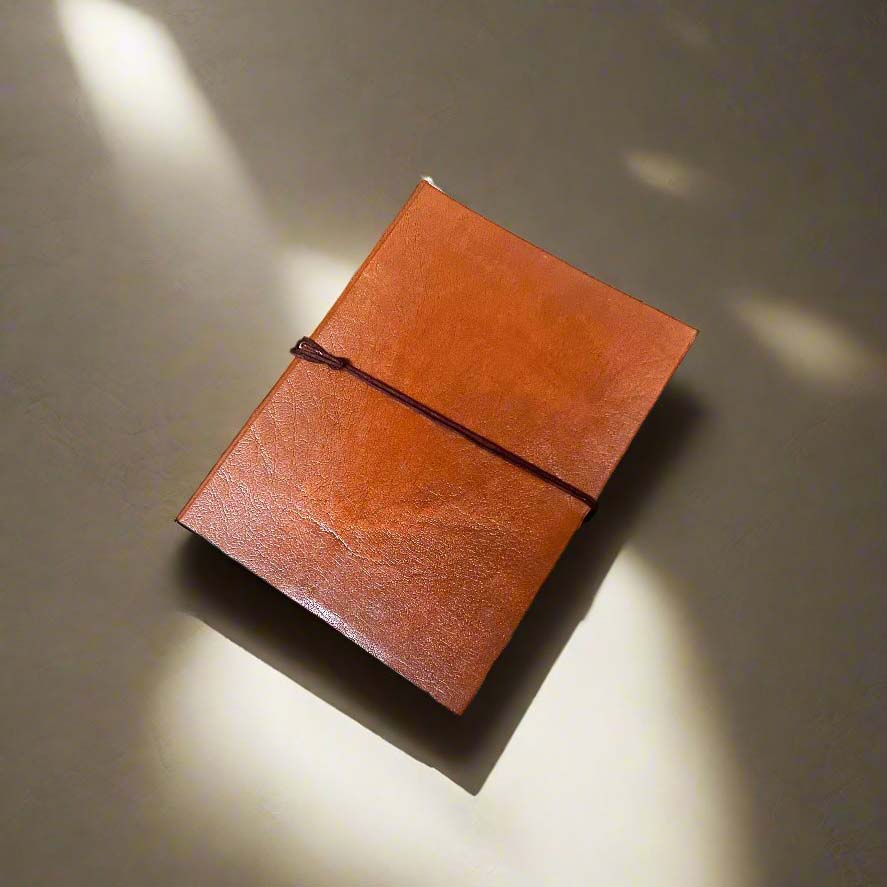 Tangerine Plain Cover Leather Journal, cover detail.