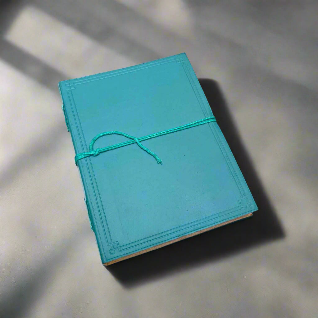 Personalized Plain Cover Leather Journal with custom black-ink text.