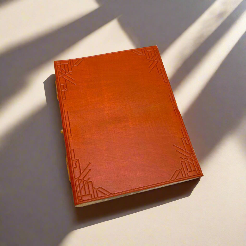 Personalized Plain Cover Leather Journal showing custom black-ink text on the front cover.