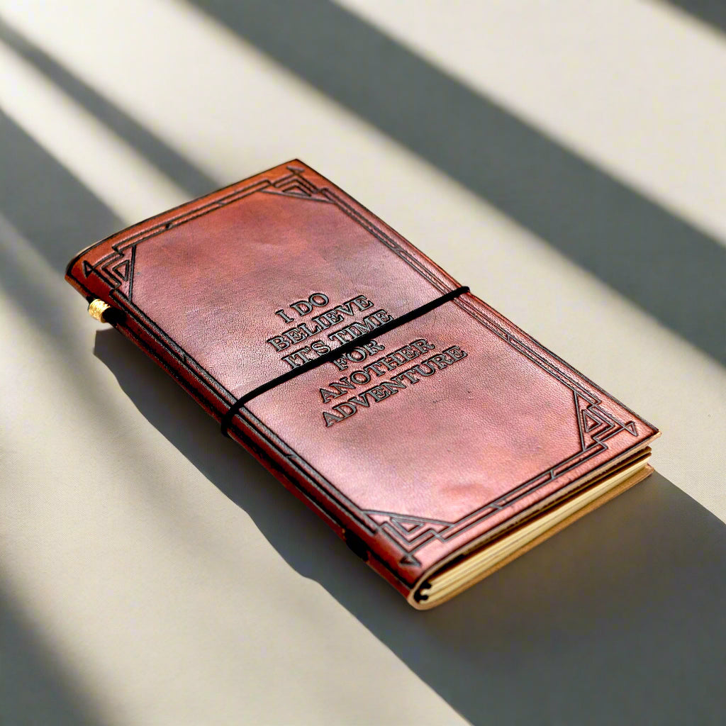 Debossed Another Adventure detail on the Quote Leather Travel Notebook.