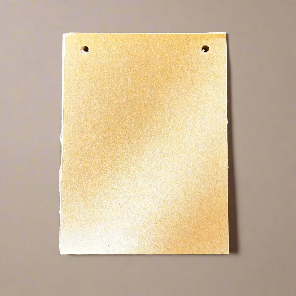 List notepad beside coffee cup on desk