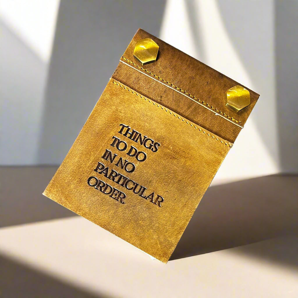Leather notepad with fresh paper refill inserted