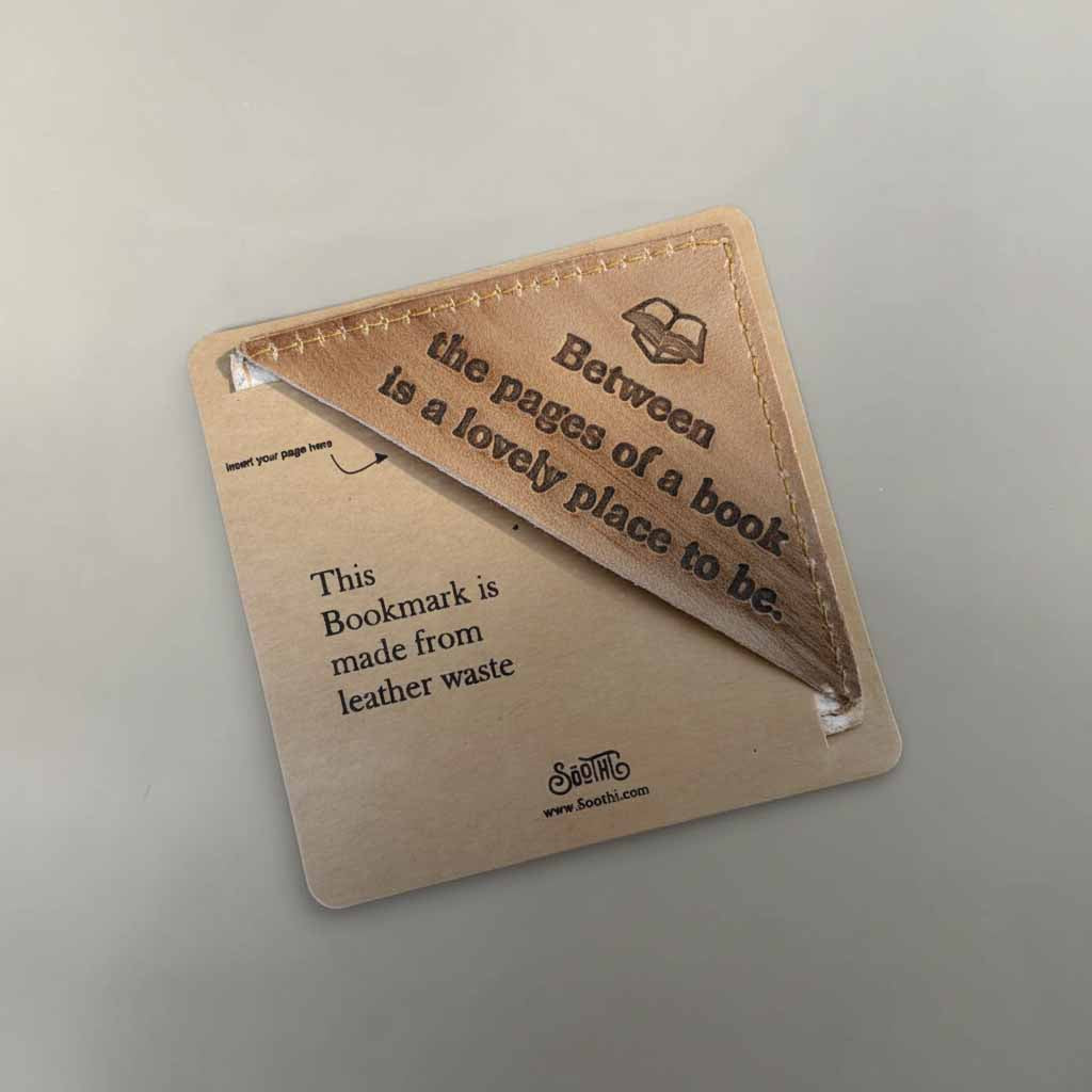 Leather bookmark with text on a light gray background