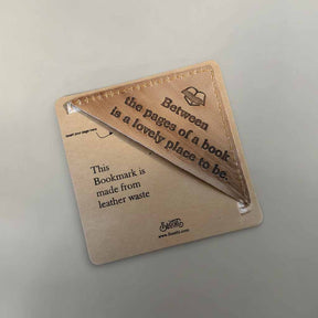 Leather bookmark with text on a light gray background