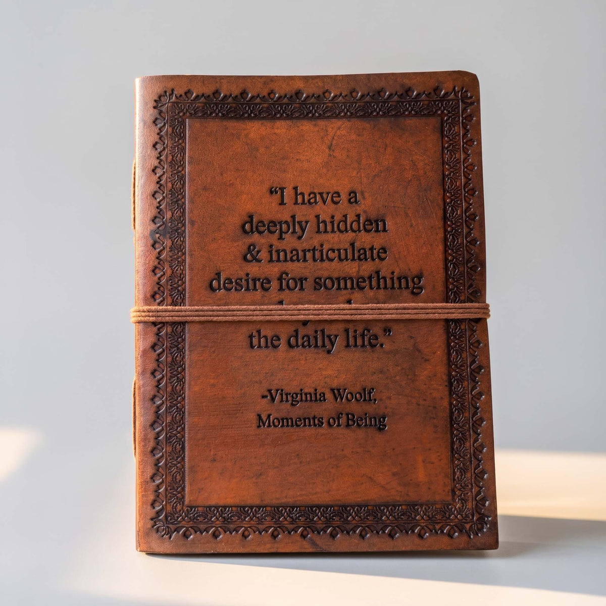 Desire Beyond Daily Life brown leather journal photographed from a different angle
