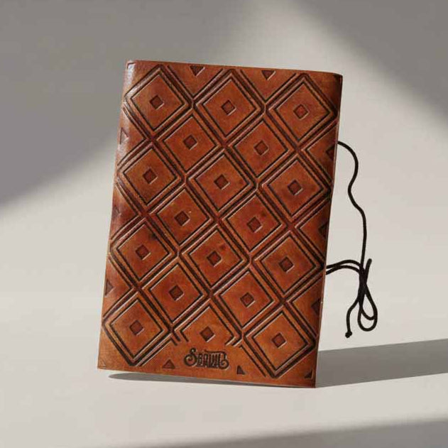 Back cover of We All Become Stories 5x7 brown leather journal
