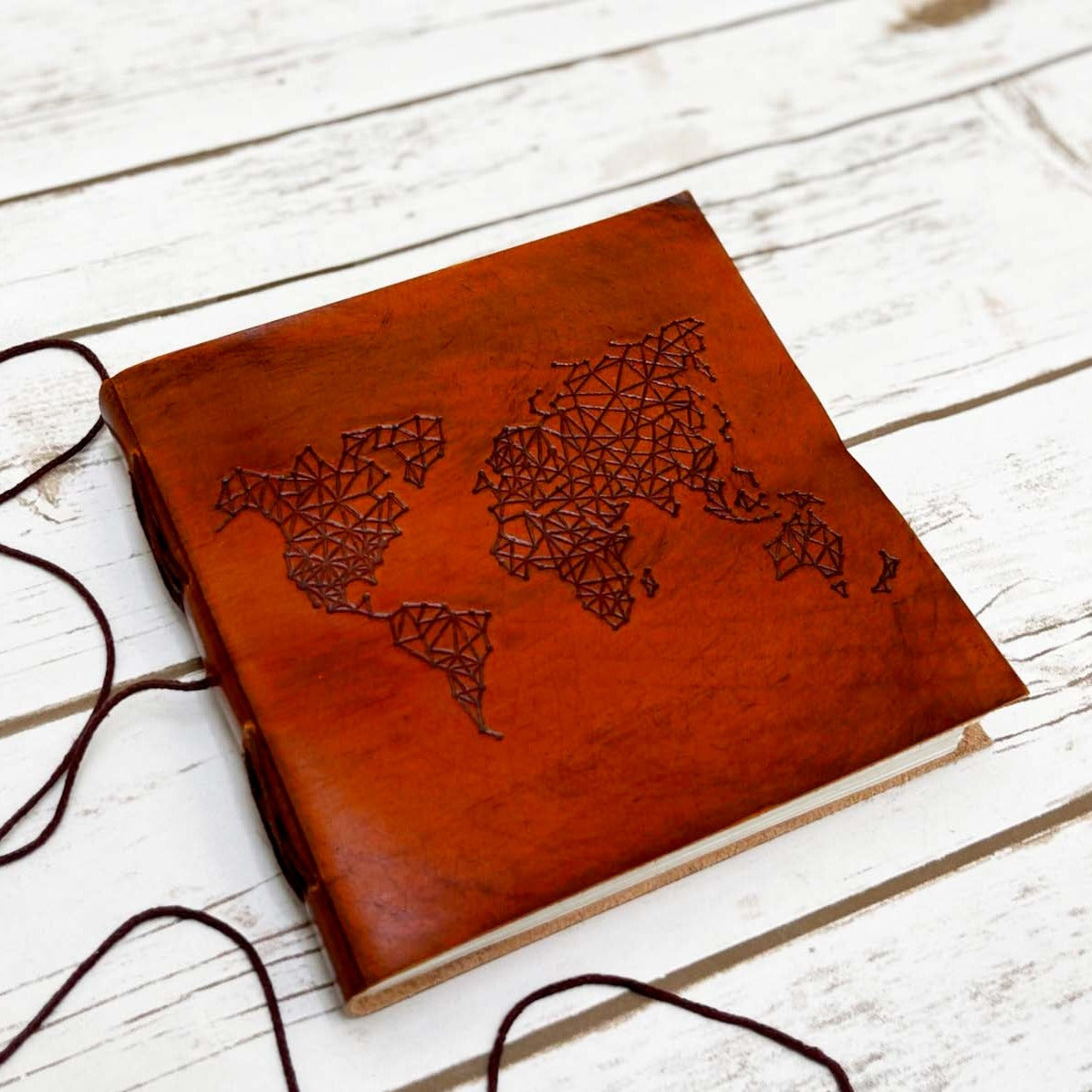 World Map 7x7 leather journal tied closed with string wrap
