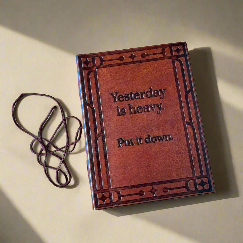 Yesterday Is Heavy Put It Down brown leather journal photographed from a different angle