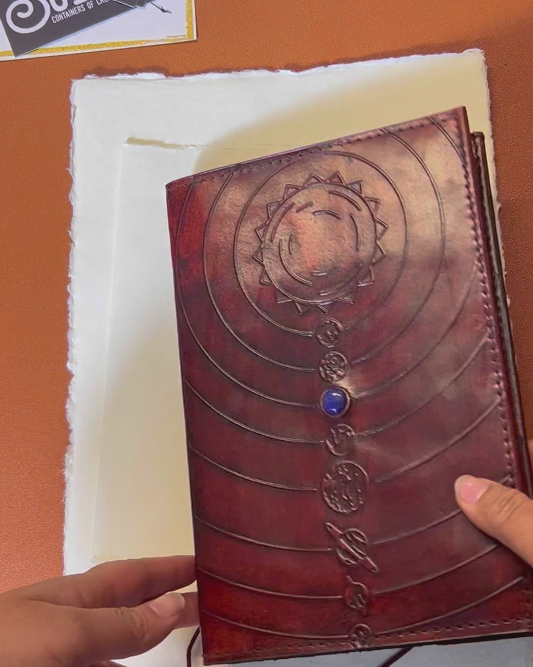 Space-themed leather notebook – embossed with galactic elements and adorned with a blue cobalt stone