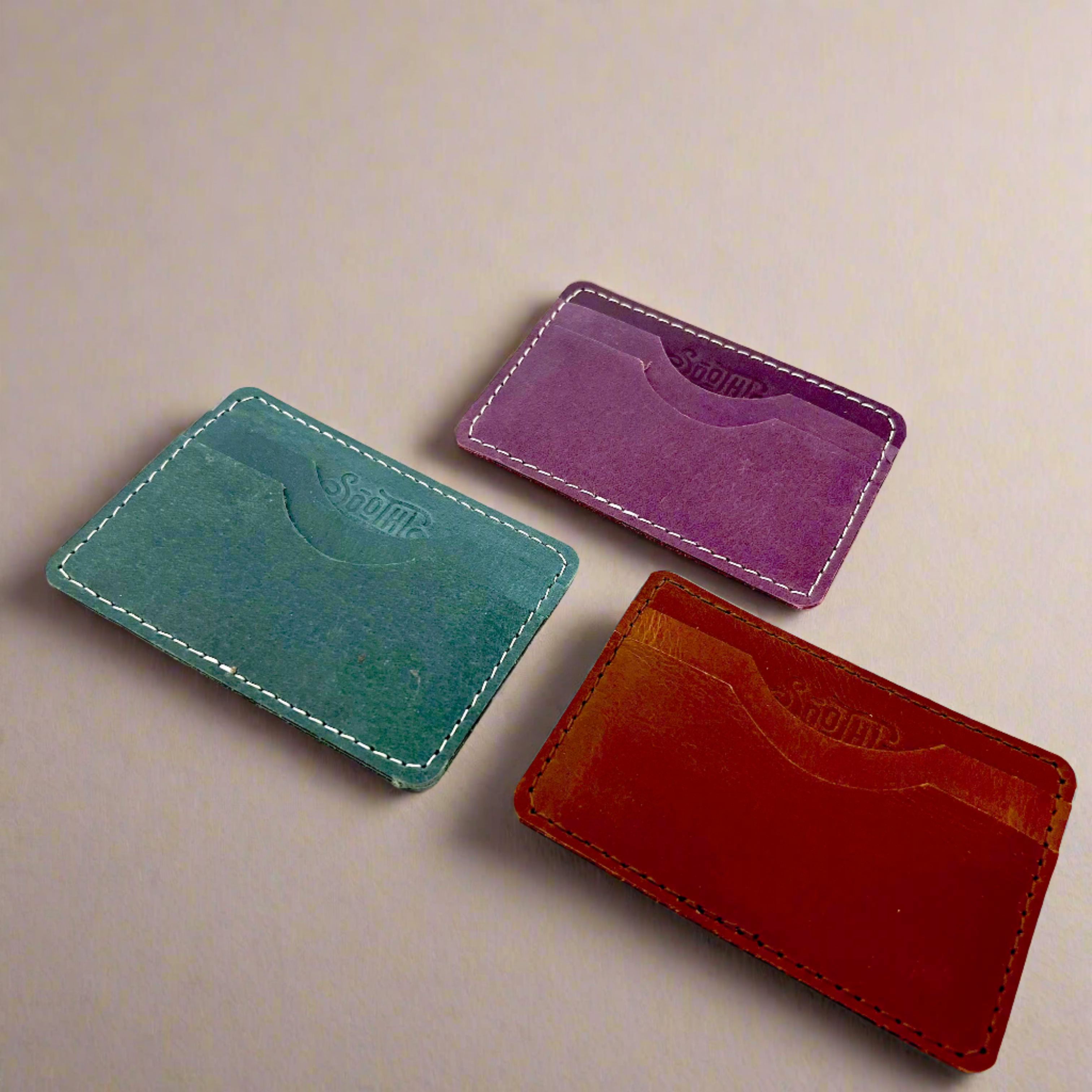 Genuine leather wallet – available in teal, purple, and brown for a pop of personality with timeless style