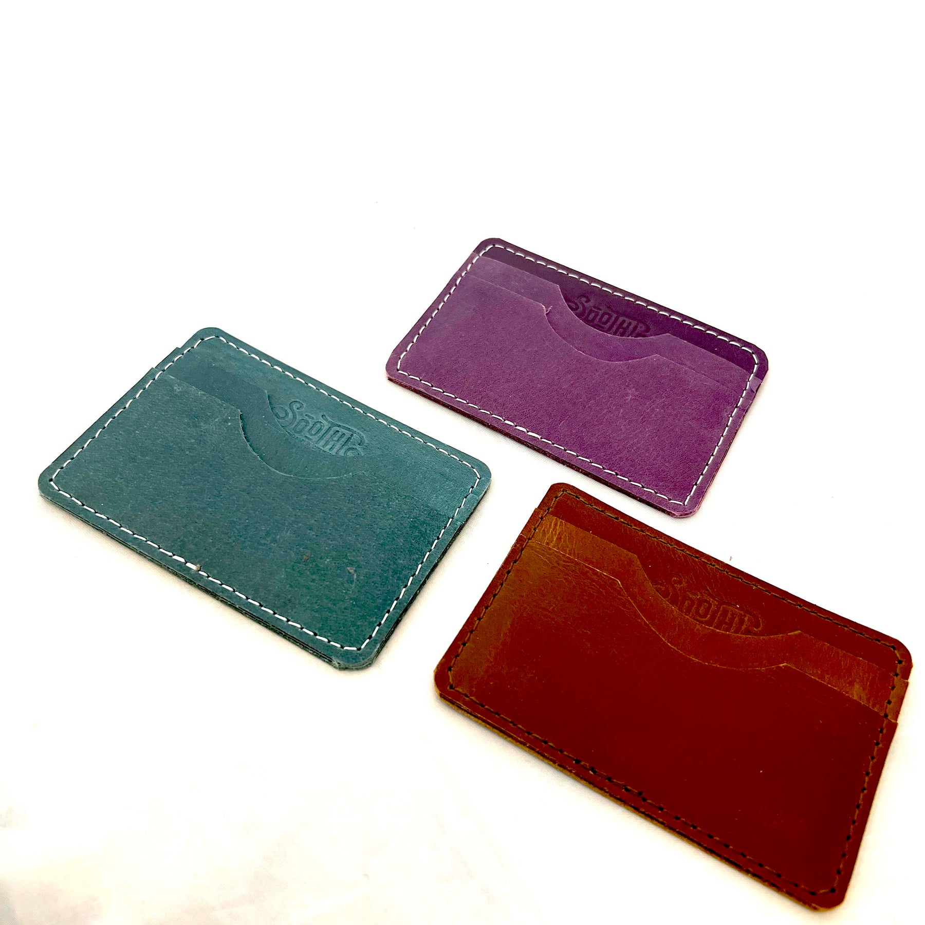 Genuine leather wallet – available in teal, purple, and brown for a pop of personality with timeless style