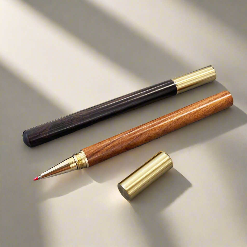 Handcrafted wood pen in oak and ebony with metallic gold accents – timeless elegance for refined writing