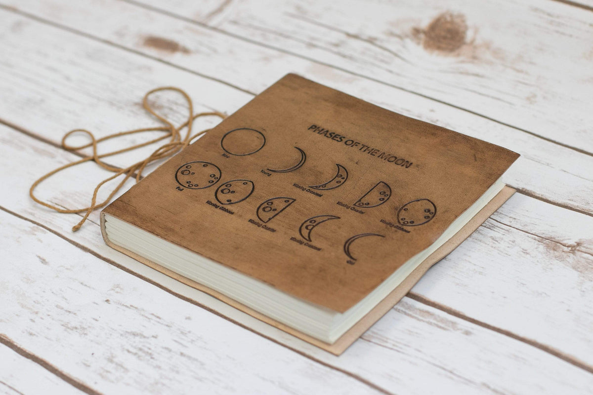 Moon Phases 7x7 leather journal in tan leather, front cover