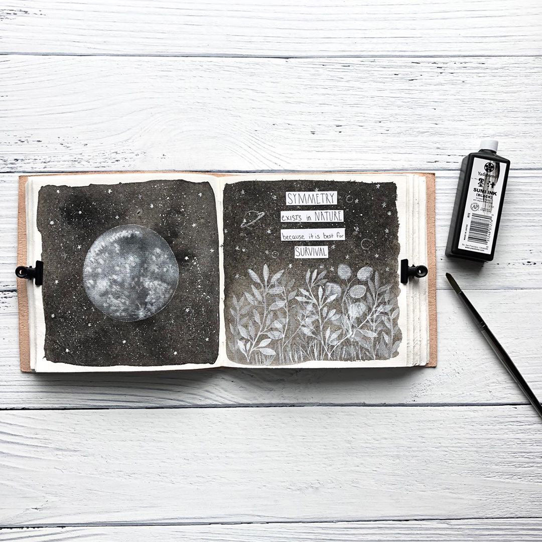 Moon Phases 7x7 leather journal open to unlined tree-free paper pages