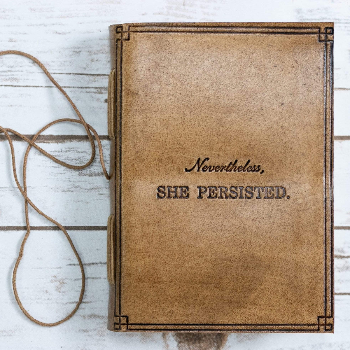 She Persisted 5x7 tan leather journal with embossed quote cover