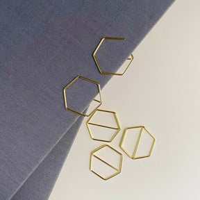 Stylish gold paper clips in unique geometric shapes – modern, functional, and perfect for adding flair to your workspace