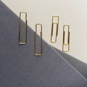 Stylish gold paper clips in unique geometric shapes – modern, functional, and perfect for adding flair to your workspace