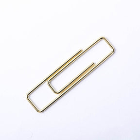 Stylish gold paper clips in unique geometric shapes – modern, functional, and perfect for adding flair to your workspace