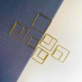 Stylish gold paper clips in unique geometric shapes – modern, functional, and perfect for adding flair to your workspace